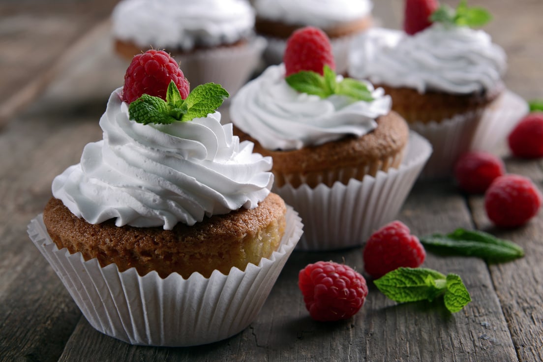 Delicious Cupcakes with Berries and Fresh Mint Close up